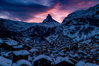 Scenic view of snowcapped mountains against sky during winter