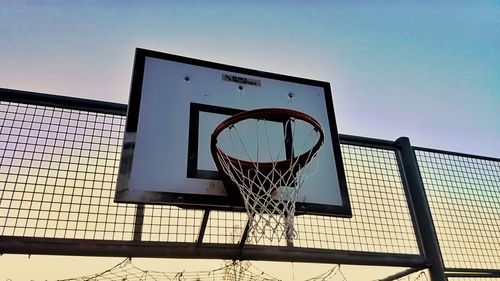 Low angle view of basketball hoop against sky