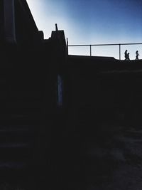 Silhouette of woman against sky