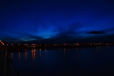 Reflection of illuminated buildings in water