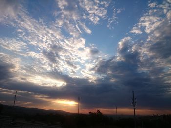 Scenic view of landscape against cloudy sky