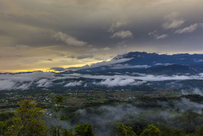 Scenic view of mountains against dramatic sky
