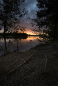 Scenic view of landscape against sky at sunset