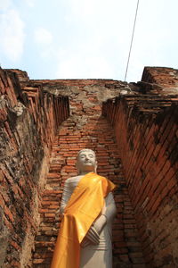 Low angle view of statue against sky