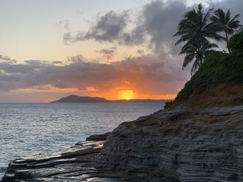 Scenic view of sea against sky during sunset