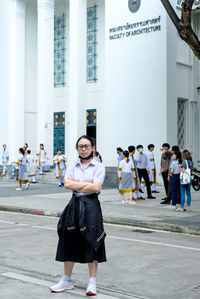 Full length of woman standing on street