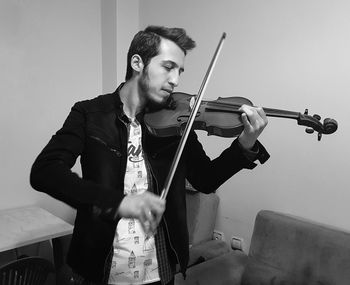 Young man playing violin