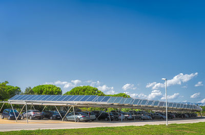 Built structure on field against blue sky