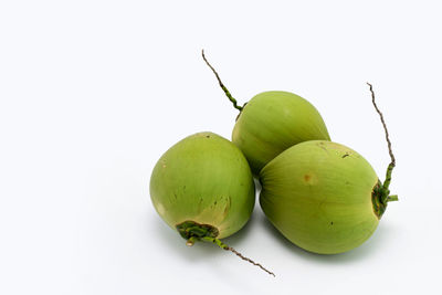 Close-up of fruits against white background