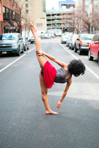 Full length of woman on road