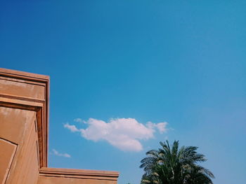 Low angle view of building against blue sky