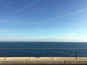 Scenic view of sea against blue sky