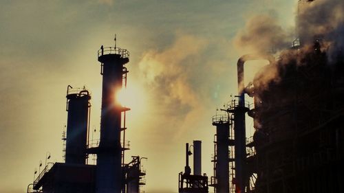 Low angle view of factory against sky