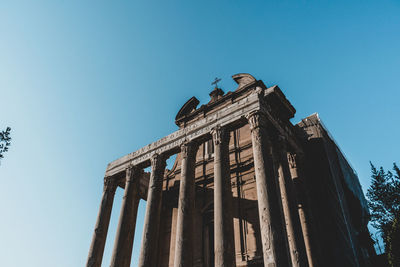 Low angle view of historical building against clear blue sky