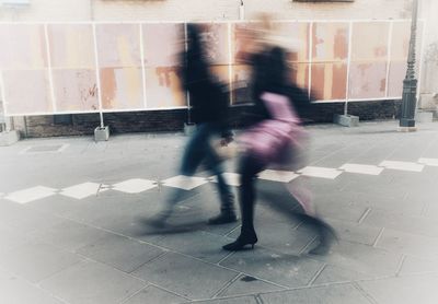 Blurred motion of man walking in bus