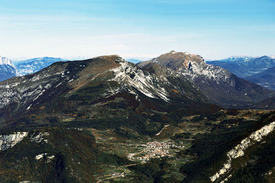 Bondone mountains and valley panorama in autumn, trentino, italy