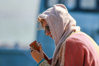 Portrait of woman playing outdoors