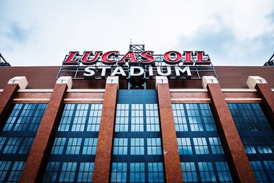 Low angle view of text on building against sky