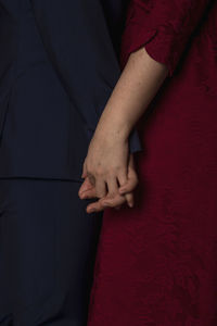 High angle view of couple holding hands