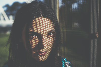 Sunlight falling on face of young woman