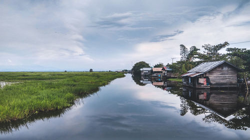 Scenic view of agricultural landscape against sky