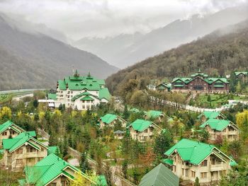 High angle view of townscape and mountains