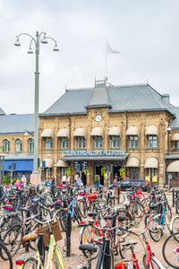 Bicycles parked on street against buildings in city