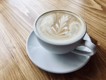 Close-up of cappuccino served on table
