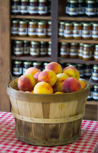 Bushel of peaches and jars of jam