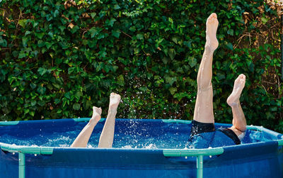 Reflection of man in swimming pool