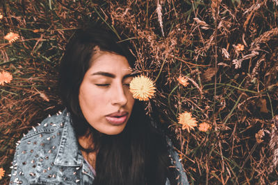 Portrait of young woman with eyes closed