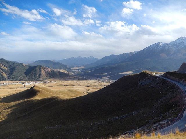 mountain, mountain range, sky, tranquil scene, scenics, landscape, tranquility, beauty in nature, nature, cloud - sky, transportation, cloud, non-urban scene, road, remote, idyllic, day, physical geography, outdoors, no people