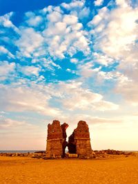 Old ruin building against cloudy sky