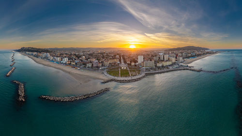 High angle view of sea against sky during sunset