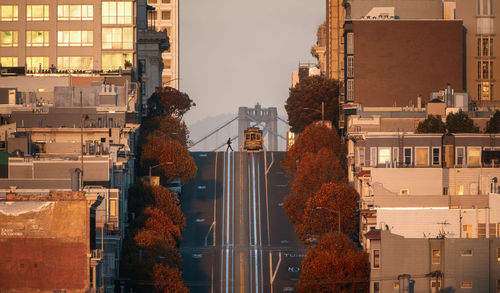 View of road amidst buildings in city