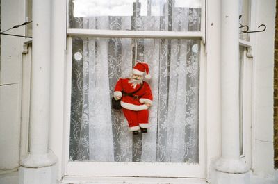 Red umbrella on door in front of building
