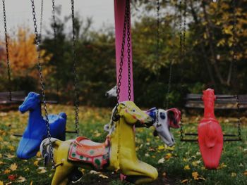 Close-up of swing ride in park