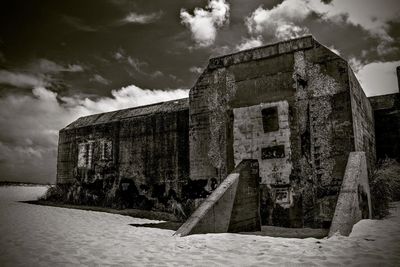 Old abandoned building against sky