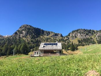 Scenic view of landscape against clear blue sky