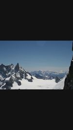 Scenic view of snow covered mountains