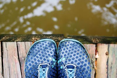 High angle view of blue shoe on jetty