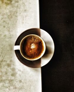 Directly above shot of coffee cup on table