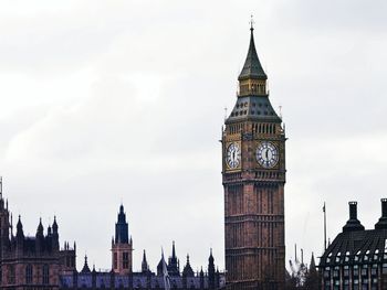 Low angle view of clock tower against sky