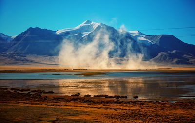 View of lake with mountain range in the background