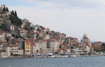 Buildings in city against sky