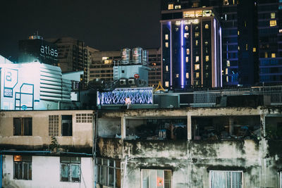 Illuminated buildings in city at night