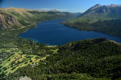 Scenic view of lake and mountains against sky