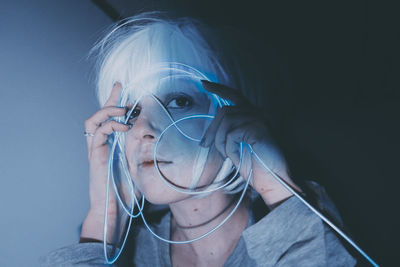 Portrait of young woman wearing mask