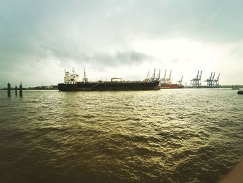 Scenic view of sea against cloudy sky