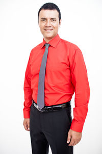 Portrait of a smiling young man against white background